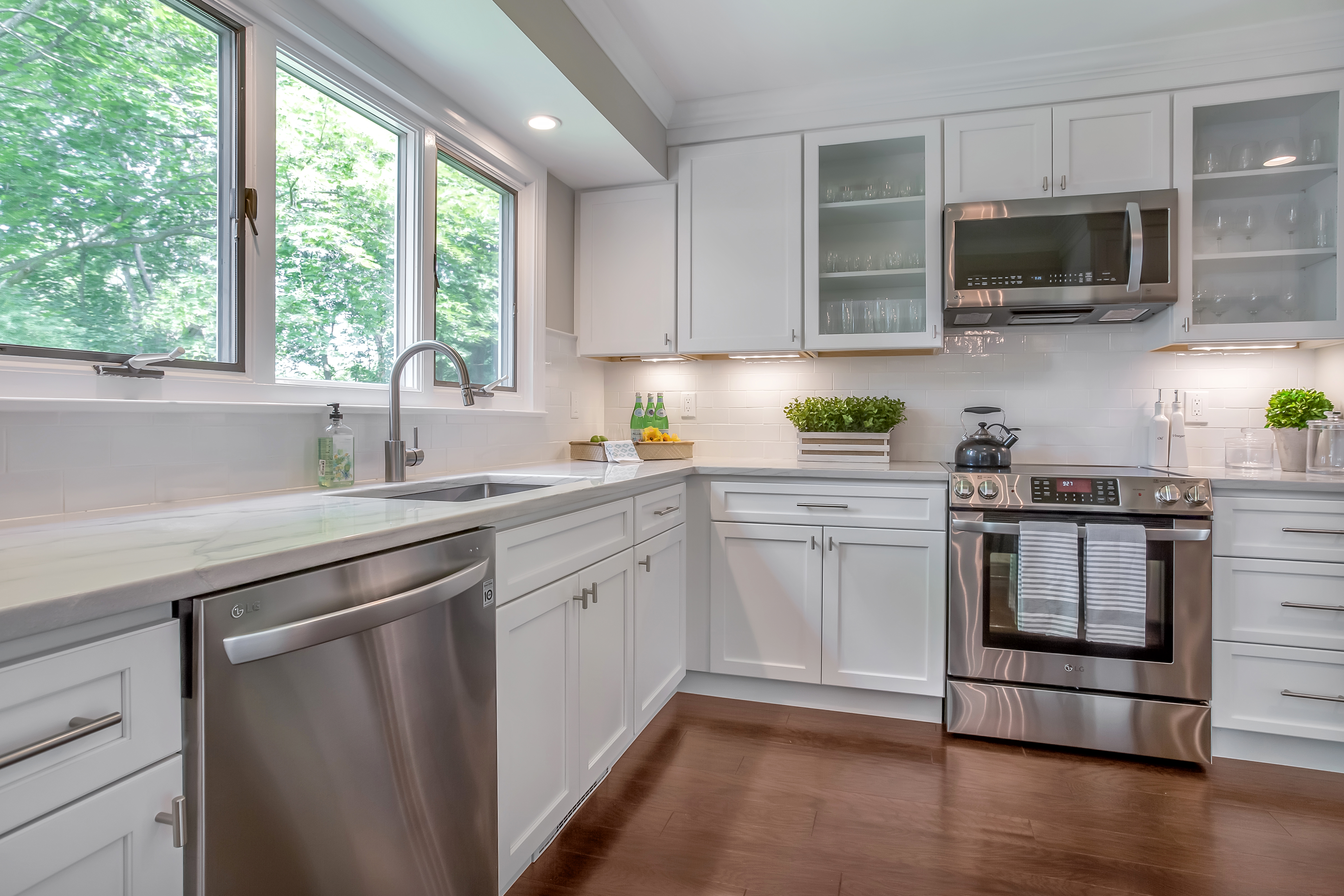 a white, light-filled updated kitchen